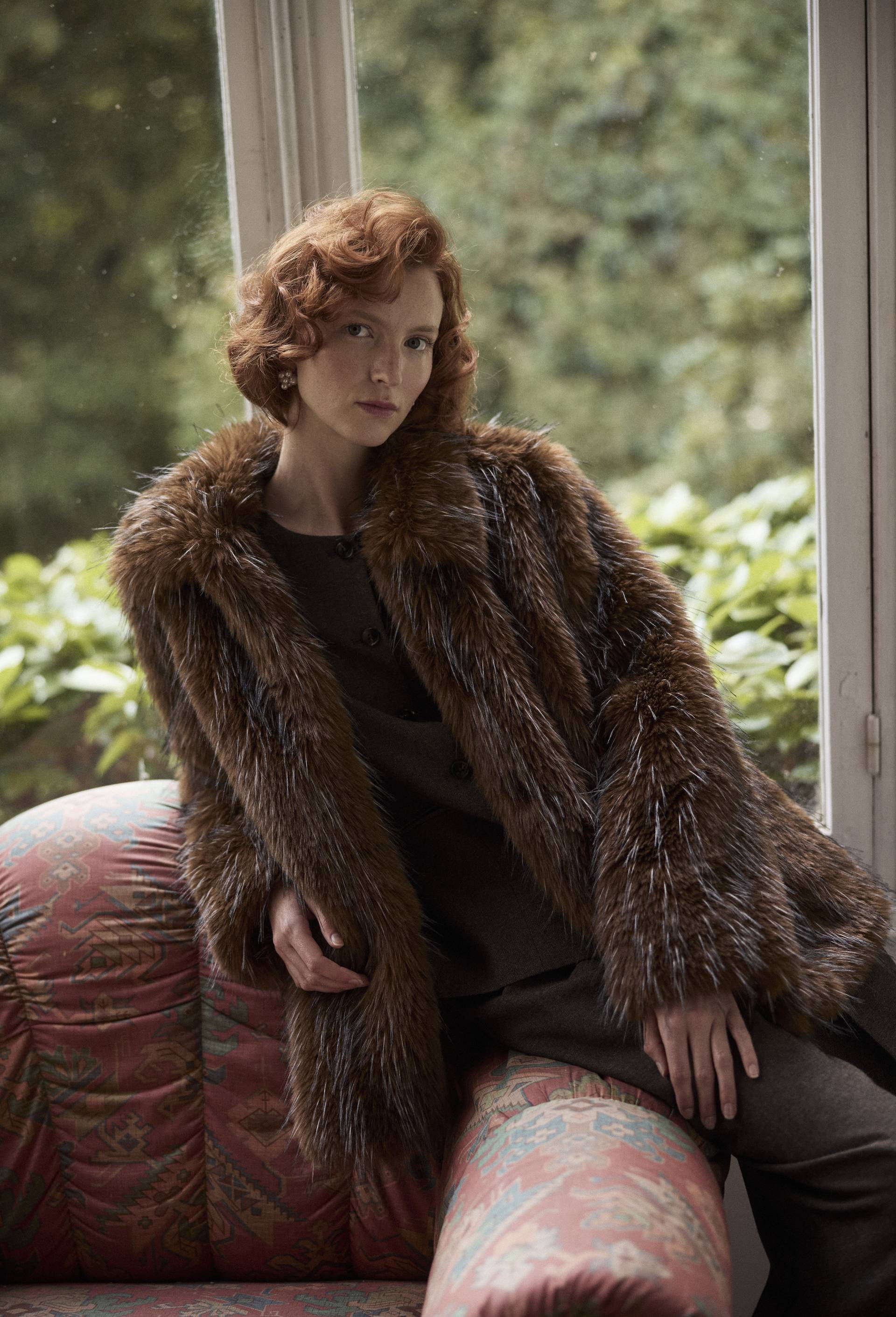 Manteau court en fausse fourrure